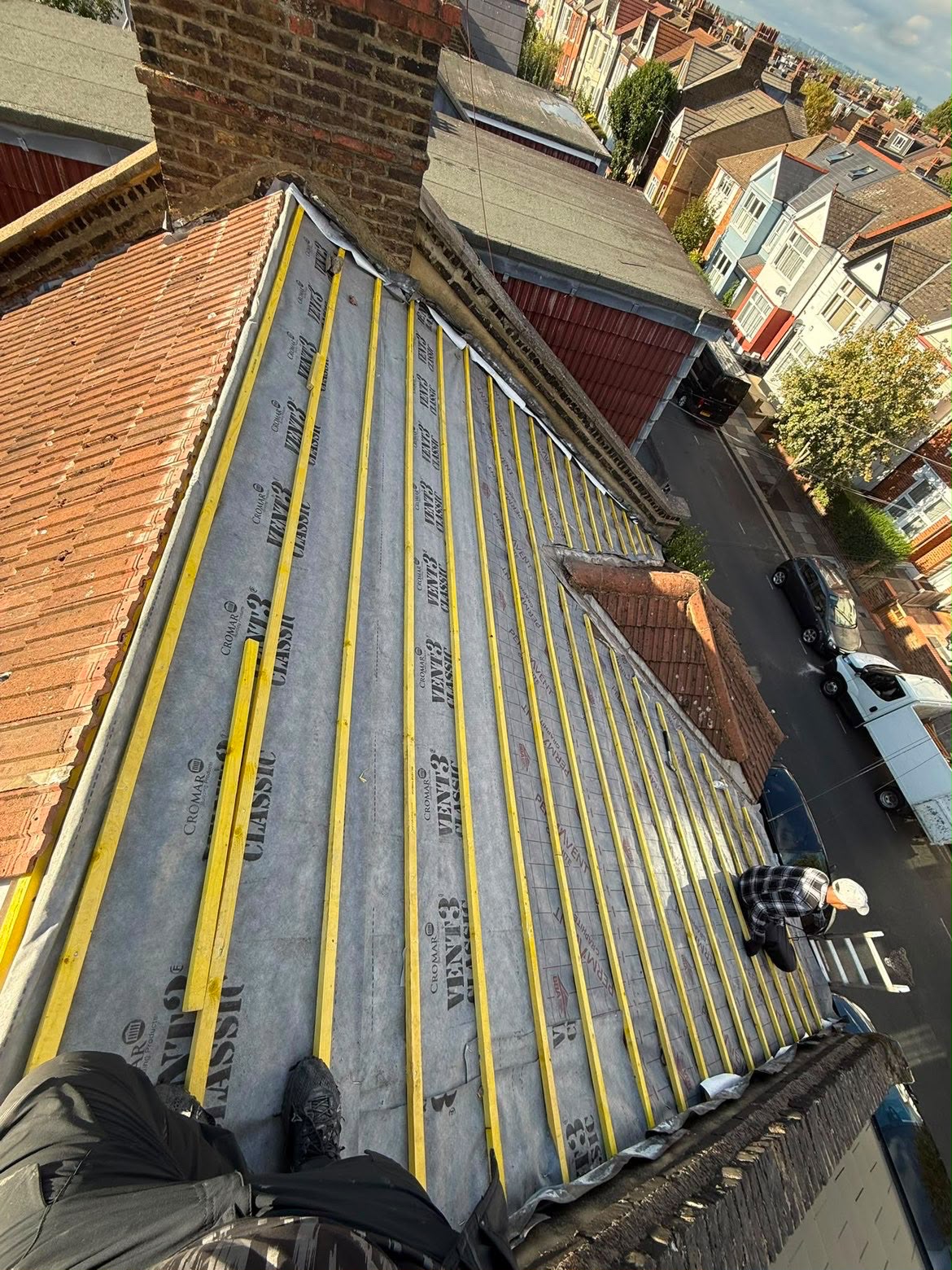 Ridge & Crown roofer fixing new battens over breathable membrane during a full re-roof